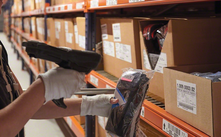 Operators collect CLOTHING for FASHION ECOMMERCE orders off the shelving for picking