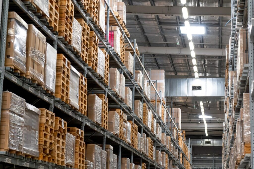 store retail warehouse with shelves, racks, pallets and goods