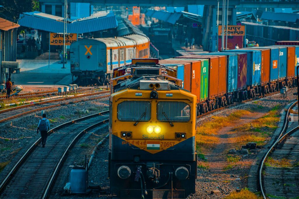Container freight train with stacked shipping containers at a rail terminal