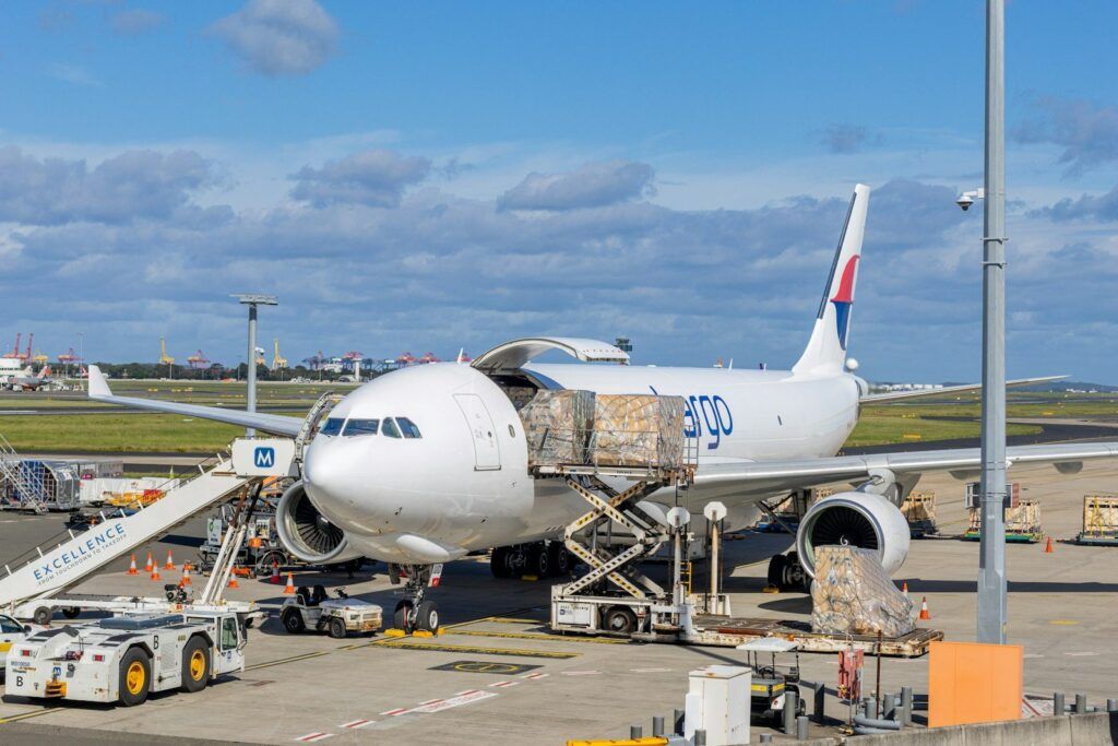 Cargo plane being loaded with freight on an airport apron
