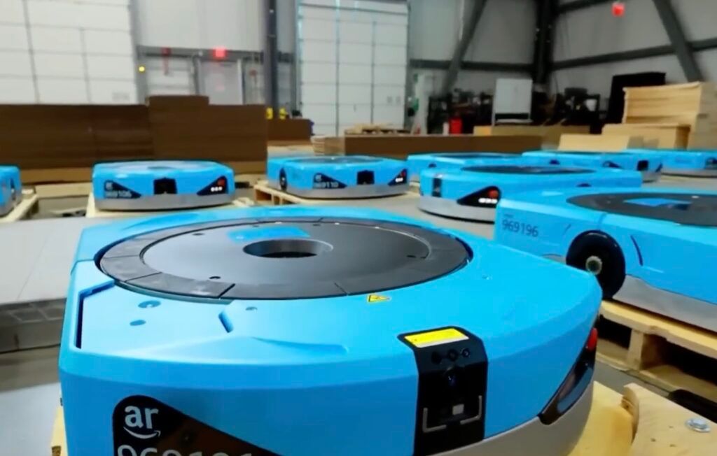 Amazon Robotics Hercules drive units, the blue robots that lift and move inventory pods and tote towers