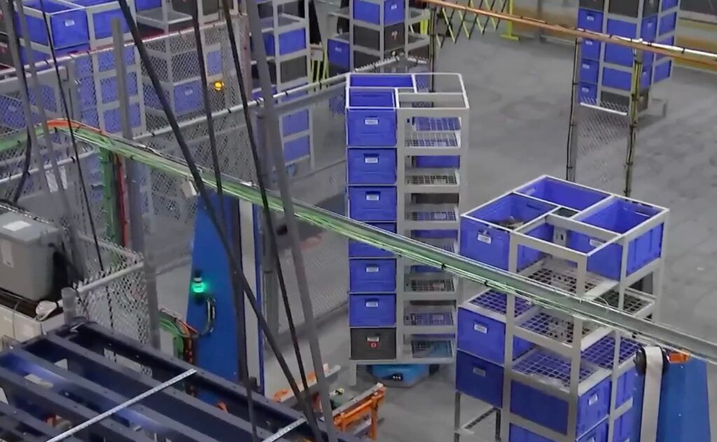 Amazon Sequoia robotic system: towers of inventory totes moved by Hercules drive units