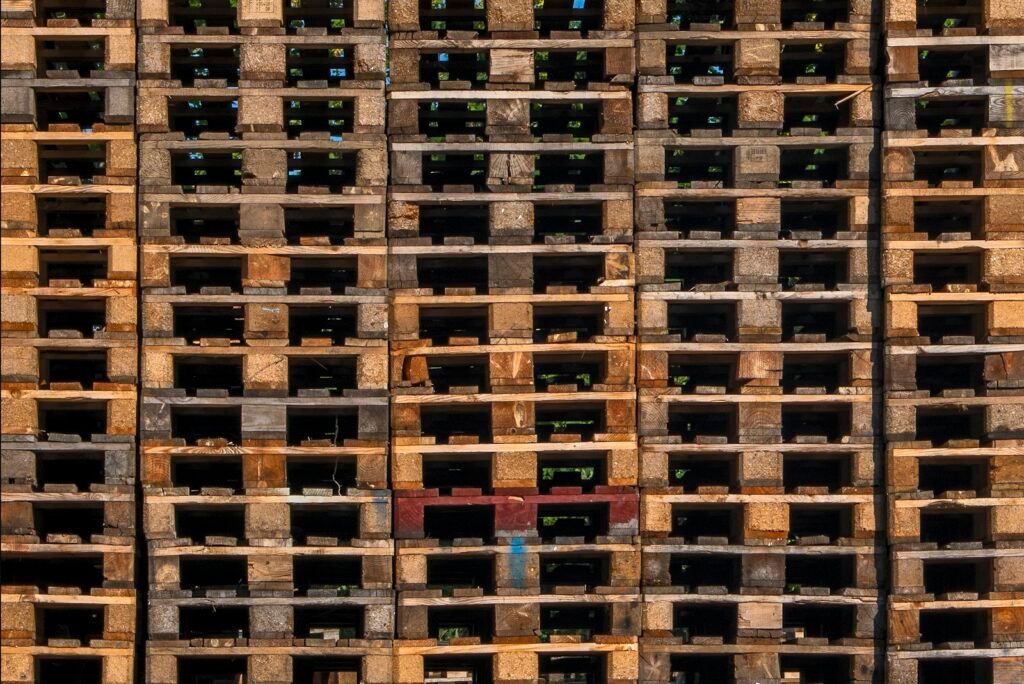 Large stack of wooden Euro pallets